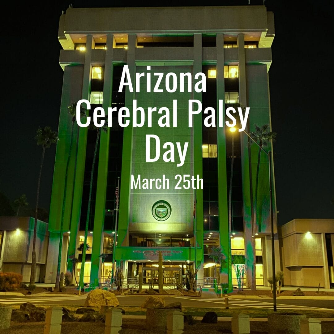 Az state capital illuminated in green with the text "UCP of Central AZ Cerebral Palsy Day March 25th" projected on the facade at night.