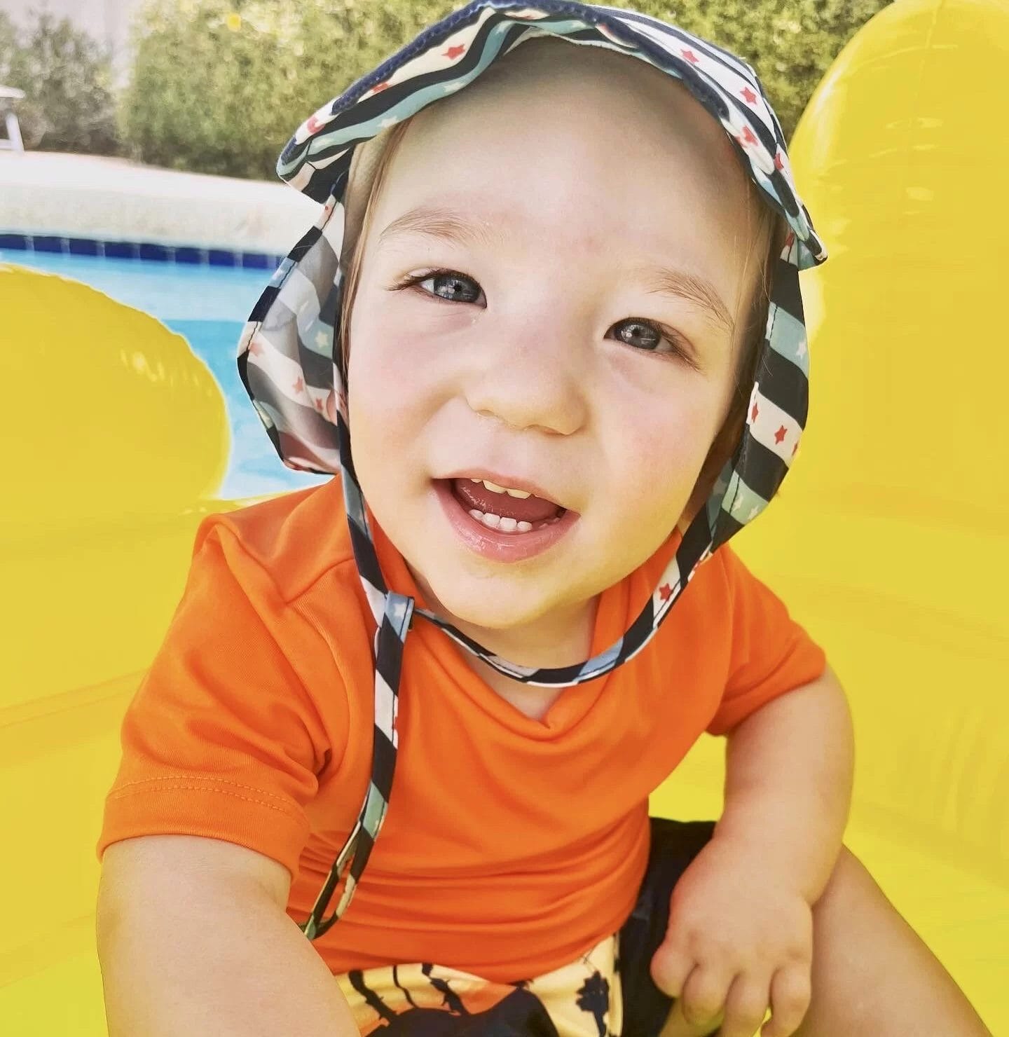 Jordan our ambassador for united cerebral palsy wearing a hat in a pool.